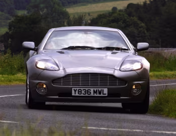 Aston Martin V12 Vanquish [UK-spec] '2001–06
