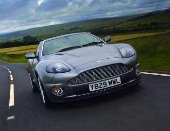 Aston Martin V12 Vanquish [UK-spec] '2001–06