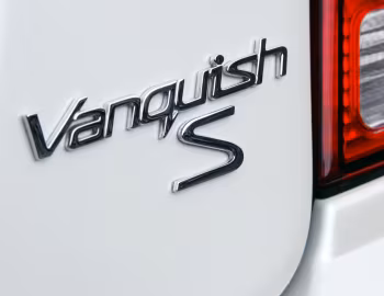 Aston Martin V12 Vanquish S [UK-spec] '2004–07