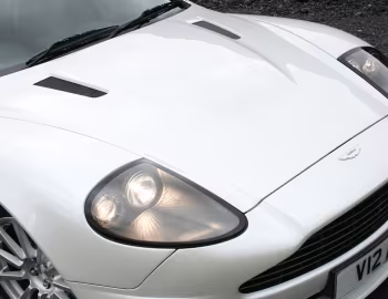 Aston Martin V12 Vanquish S [UK-spec] '2004–07