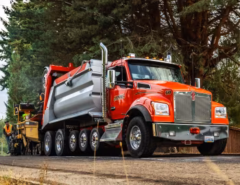 Caterpillar AP-Series Asphalt Pavers, Kenworth T880S OSW Super Dump