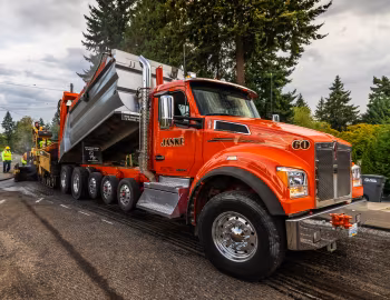 Caterpillar AP-Series Asphalt Pavers, Kenworth T880S OSW Super Dump