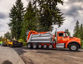 Caterpillar AP-Series Asphalt Pavers, Kenworth T880S OSW Super Dump