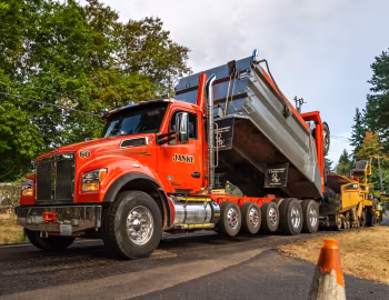 Caterpillar AP-Series Asphalt Pavers, Kenworth T880S OSW Super Dump