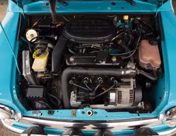 Під капотом Mini Cooper Sports Pack Stage 1 Powerkit [EU-spec] (ADO20) '1998