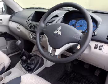 Торпедо Mitsubishi L200 Tipper [UK-spec] '2006–10