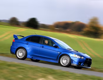 Mitsubishi Lancer Evolution X FQ-400 [UK-spec] '2009–16