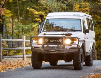 Toyota Land Cruiser Troop Carrier with Trakka Bushman Pop Top [Australia] (HJ75) '1985–????