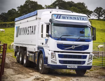 Volvo FM 410 8×4 tridem Globetrotter cab with Priden Engineering tipper body [UK-spec] '2010–13