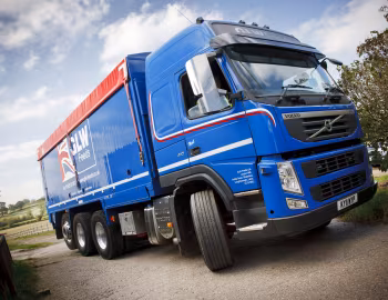 Volvo FM 410 8×4 tridem Globetrotter cab with Priden Engineering tipper body [UK-spec] '2010–13