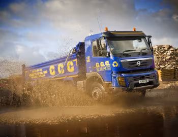 Volvo FMX 410 8×4 rigid Day cab with ABBA tipper body [UK-spec] '2009–13